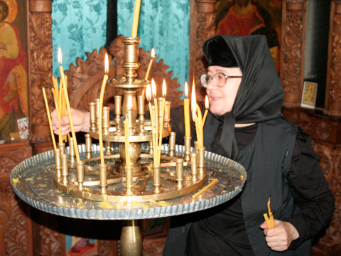 Tending candles inthe church